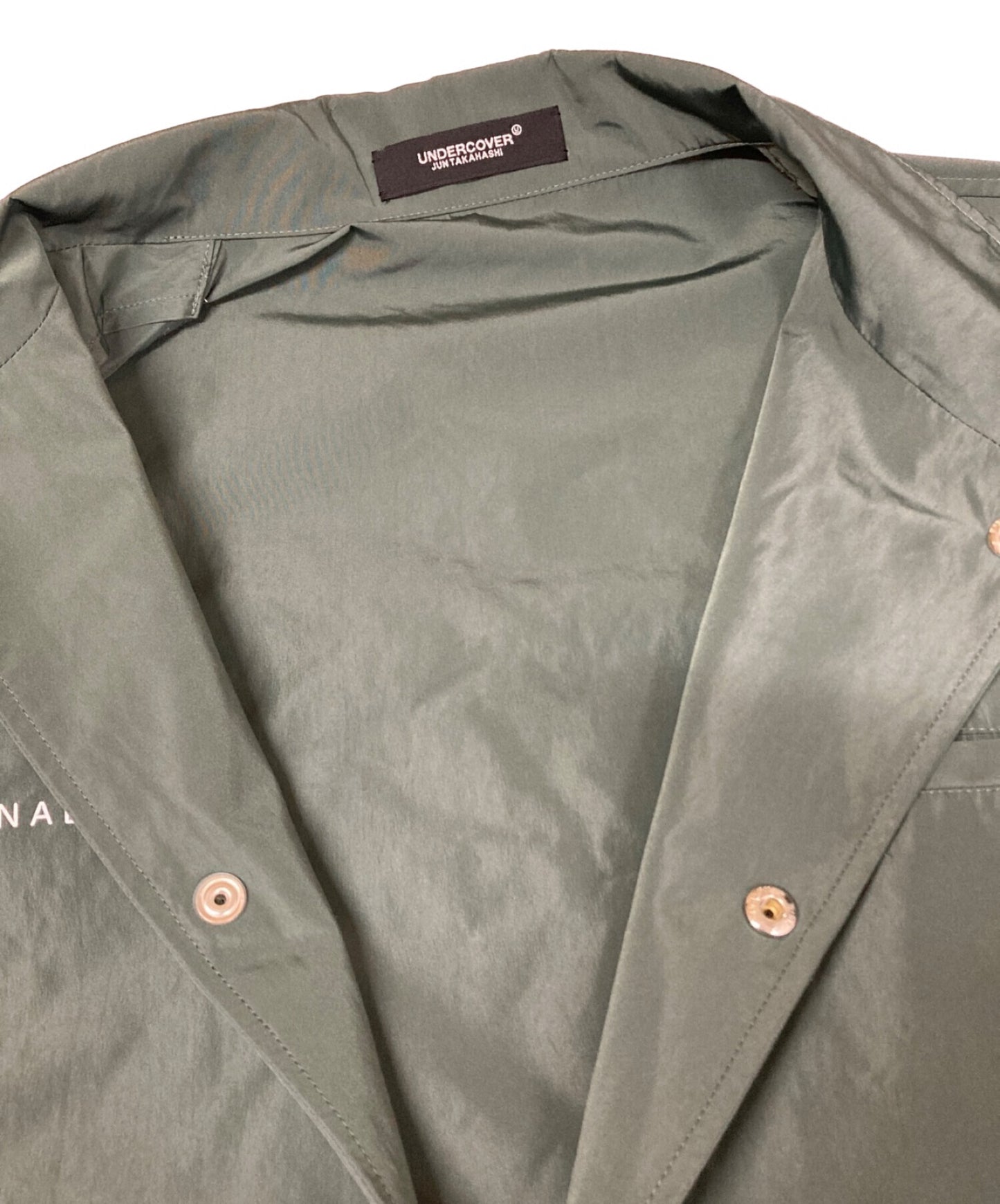 짧은 슬리브 빅 코치 JKT UC1B4402를 비밀리에 올리십시오