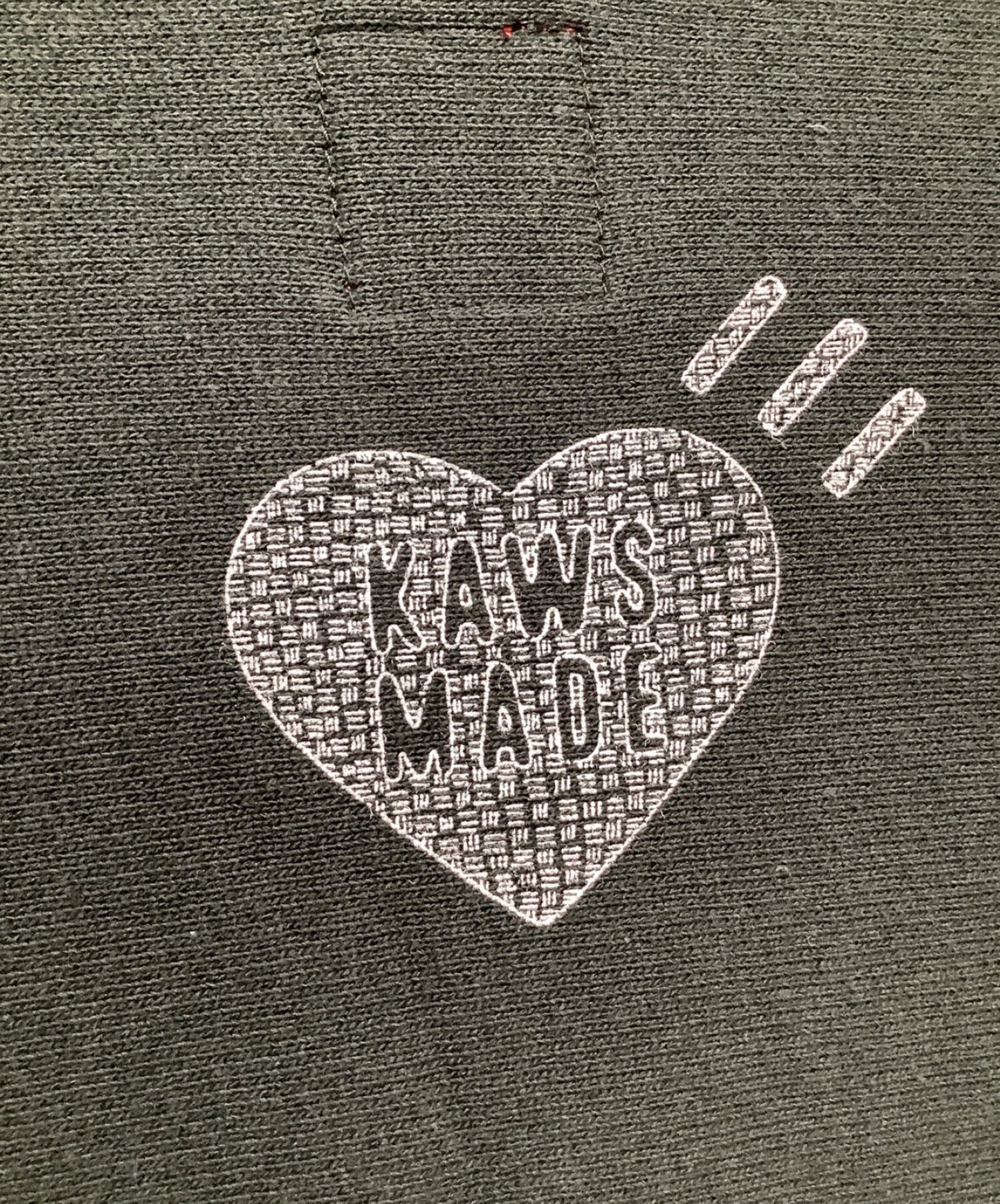 인간 만든 × KAWS 승무원 목 스웨트 셔츠
